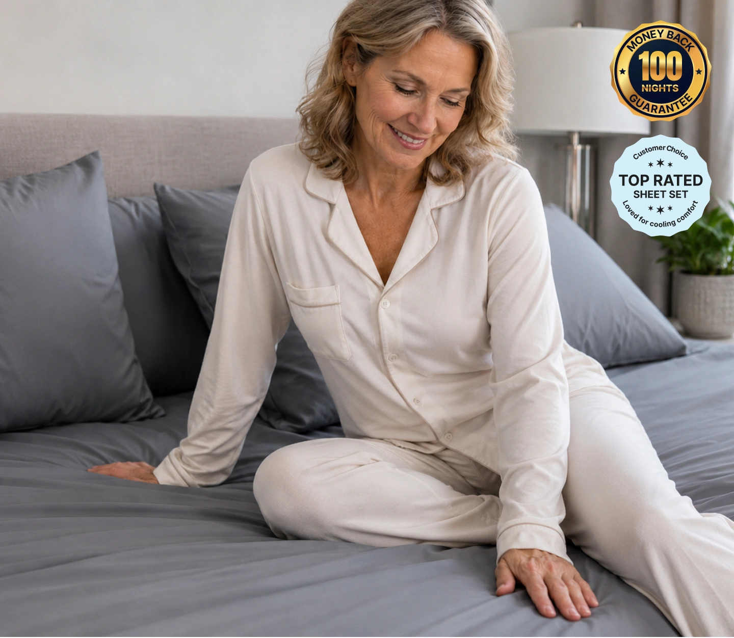 Woman sitting comfortably on a bed with 100-night guarantee and top-rated sheet set badges